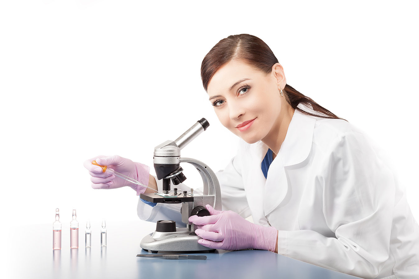 Scientist working at a microscope